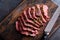 Corned beef cooked and sliced on a cutting board