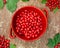 Cornel berries in red bowl
