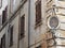 Corner of an ancient building with a frame with a painting of the  Virgin Mary to Rome in Italy.