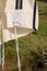 Corner of a beautiful Jewish tallit with its Tzitzit and decoration. Nature background.