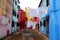 Corner beautifully designed with colorful houses and white clothes to dry in Burano in Venice in Italy