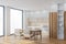 Corner of beige kitchen area with table, armchairs, panoramic windows