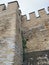 Corner of the castle walls with ivy growing in it