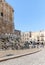 The corner of the fortress wall surrounding Tower of David and crowded Omar Ben el-Hatab street near Jaffa Gate in the old city of