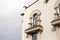 Corner of a house with white facade.