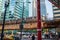 Corner of Lake and LaSalle Streest where commuters walk and ride the el train on elevated track above Chicago Loop