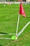 Corner post on a soccer pitch with yellow cone