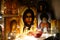 Corner for prayer. Russian traditional home church. Prayer to God. Icons illuminated by a garland. Jesus Christ. Ancient orthodox