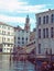 Corner the rialto area of central venice on a sunlit morning with gondolas moored next to the grand canal with an unrecognizable