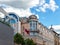 Corner rotunda with columns and a glass dome against the blue sky