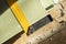 Corner ruler on drywall sheets. The stack of gypsum board preparing for construction. View from above.