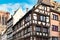 Corner of traditional European style half timbered frame house in historical city center of Strasbourg in France