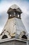 A corner turret on the roof of an old mansion. Architectural detail