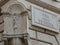 Corner of via della Vitrina with a religious statue to Rome in Italy.