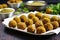 a corner view of a tray full of uncooked falafel balls