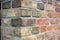 Corner of a vintage brick wall , stone brick wall edge