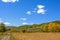 cornfield and mountain forest in the autumn