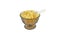 Cornflakes in a brownish traditional glass bowl with stand and a white chinese spoon half buried in the cornflakes