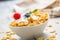 Cornflakes. Dish of cornflakes with yogurt blueberries and raspberries on kitchen table