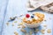 Cornflakes. Dish of cornflakes with yogurt blueberries and raspberries on kitchen table