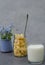 Cornflakes glass of milk on a gray background.