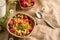 Cornflakes and other cereals with fresh fruits of raspberries, blueberries and milk on healthy breakfast