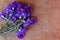 Cornflowers on the old burlap table