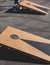 Cornhole game set, process of throwing bean bags, kids children tossing bean sacks, corn hole in the backyard, wooden boards for