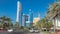 Corniche boulevard beach park along the coastline in Abu Dhabi with skyscrapers on background.