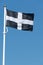 Cornish flag of St. Piran blowing in the wind.