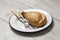 Cornish pasty on a white enamel plate