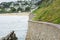 Cornish sea front, sea wall plus ocean against a beech