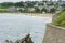 Cornish sea front, sea wall plus ocean against a beech