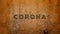 Corona and pandemic text carved on wall, shattered effect