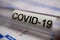 Corona virus covid-19 diagnostic, vaccination and research concept: macro closeup of isolated blood sample vial on laboratory