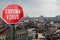 Corona virus stop sign with panorama of Brussels, Belgium. Warning about epidemic quarantine. Coronavirus disease pandemic. COVID-