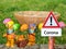 Corona warning sign with Easter bunny and basket
