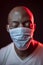 Coronavirus, African American man with protective mask and eyes closed