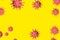 Coronavirus background with a copy of the space. A group of pink viruses on a yellow background. 3D-model