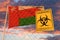 Coronavirus biohazard sign against the Omani flag. Restricted entry or quarantine in Oman. Conceptual 3D rendering