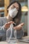 Coronavirus. Business woman working from home wearing protective mask. Business woman in quarantine for wearing protec