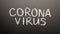 Coronavirus, chalk inscription on a black chalkboard. Pandemic, epidemic, global threat