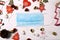 Coronavirus christmas holidays concept. Medical face mask, covid19 era Christmas holidays decorations on white background. top