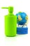 Coronavirus concept with blue protective medicine equipment mask, globe and green bottle packing of sanitizer, antiseptic with