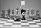 Coronavirus concept image chess pieces and hand sanitizer on chessboard