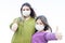 Coronavirus Covid-19 and Air pollution pm2.5 concept. Girls wearing mask for protect and show thumbs up gesture