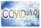 Coronavirus COVID-19 concept image with home on background - Solution concept image in jigsaw puzzle shape