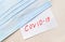 Coronavirus covid-19 covid concept. Medical protective face masks and note covid-19