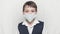 Coronavirus covid-19 epidemy outbreak healthcare concept of little boy in medical mask and school uniform