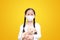 Coronavirus covid-19 and pollution protection concept. Asian little child girl hugging teddy bear doll with wearing mask to